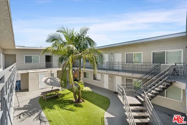 a view of house with a swimming pool outdoor seating