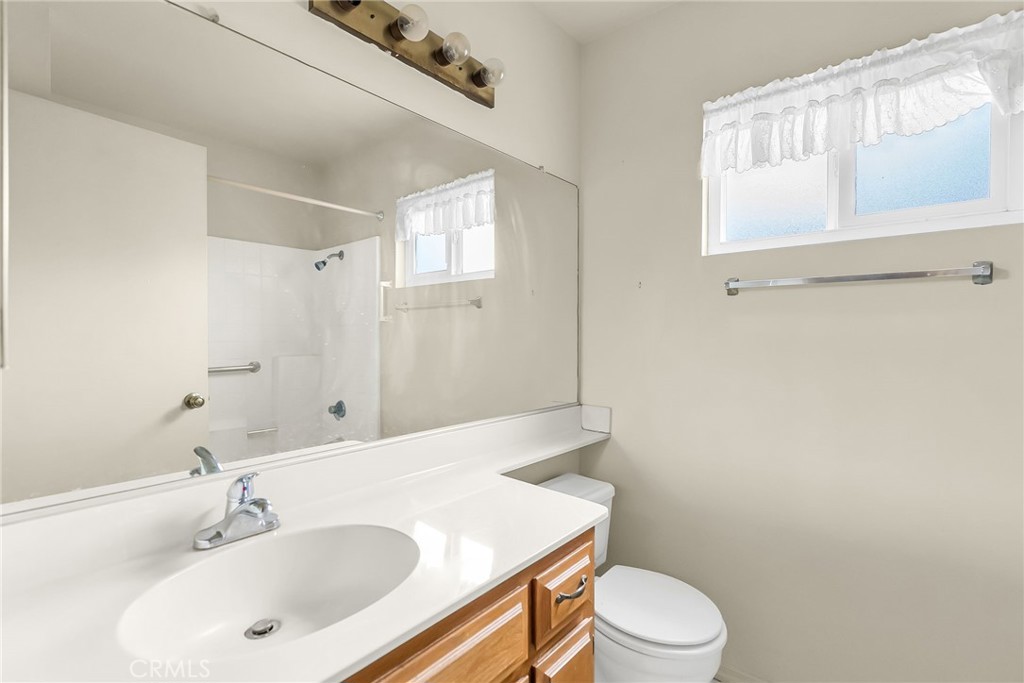 2892 Jackson Street Riverside, CA 92503 - Photo 20 of 29 a bathroom with a sink toilet and mirror