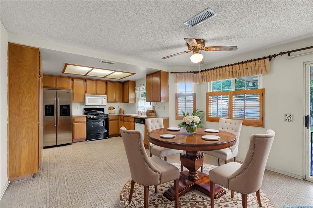 2892 Jackson Street Riverside, CA 92503 - Photo 7 of 29 a view of a dining room with furniture window and wooden floor