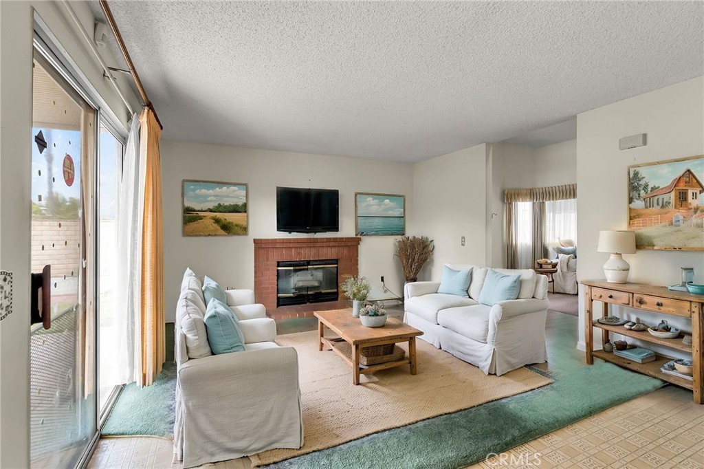 2892 Jackson Street Riverside, CA 92503 - Photo 10 of 29 a living room with furniture a rug and a fireplace