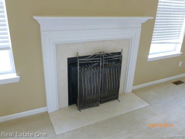 3399 Connors Drive Rochester, MI 48307 - Photo 10 of 21 Fireplace with Travertine