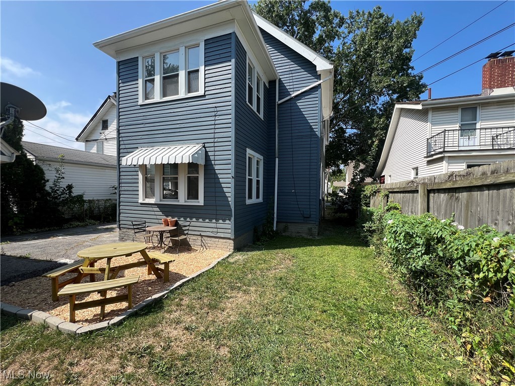 3371 Berea Road Cleveland, OH 44111 - Photo 5 of 27 Back of property featuring a lawn and a patio area