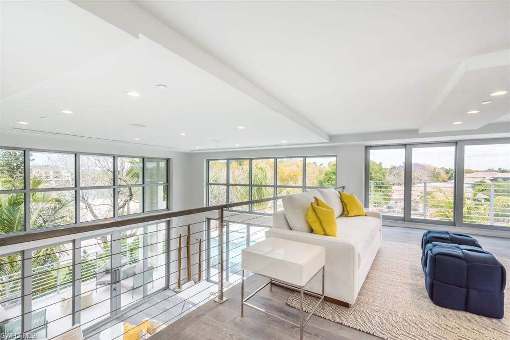 325 Banyan Boulevard Naples, FL 34102 - Photo 13 of 19 a living room with furniture and floor to ceiling windows