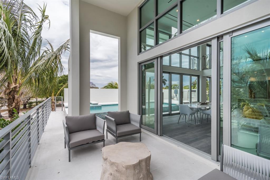 325 Banyan Boulevard Naples, FL 34102 - Photo 18 of 19 a living room with furniture and a large window