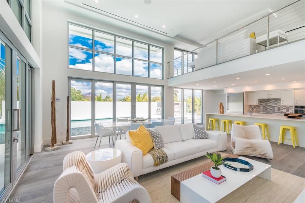 325 Banyan Boulevard Naples, FL 34102 - Photo 4 of 19 a living room with furniture and a large window