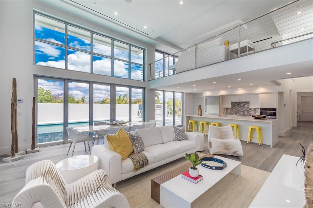 325 Banyan Boulevard Naples, FL 34102 - Photo 5 of 19 a living room with furniture and a large window