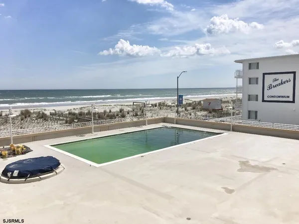 a view of a swimming pool and an outdoor space