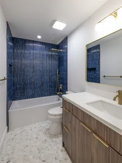 a view of utility room with closet and window