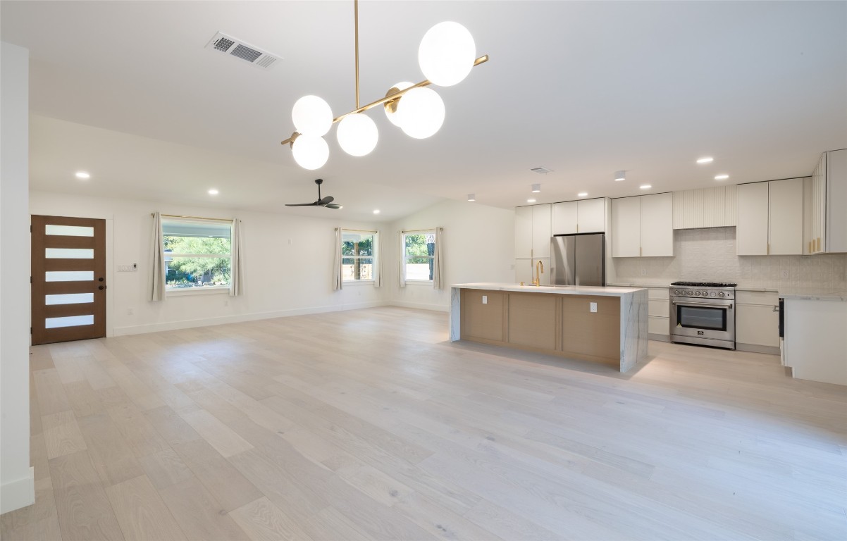 1206 Cloverleaf Drive Austin, TX 78723 - Photo 22 of 22 a view of a kitchen with a sink and chandelier