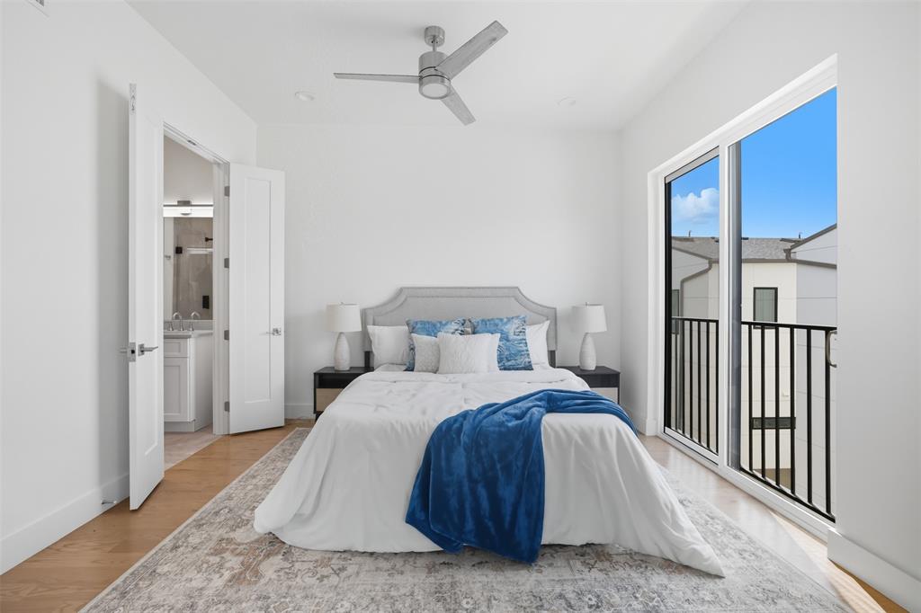 4517 Munger Avenue, Unit 101 Dallas, TX 75204 - Photo 14 of 39 a bedroom with a bed and a window