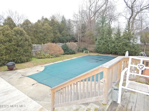 a view of a balcony with yard