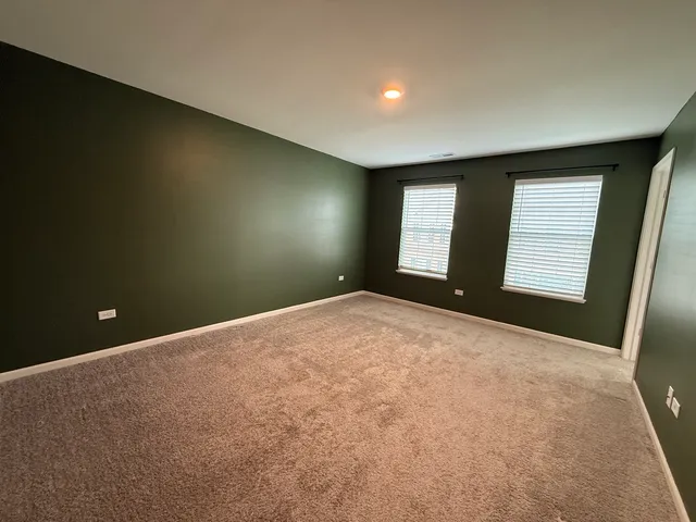 a view of empty room with windows