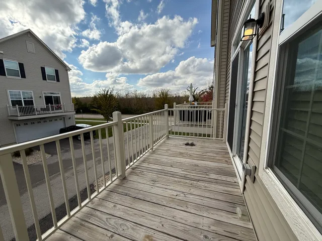 a view of a balcony with wooden floor