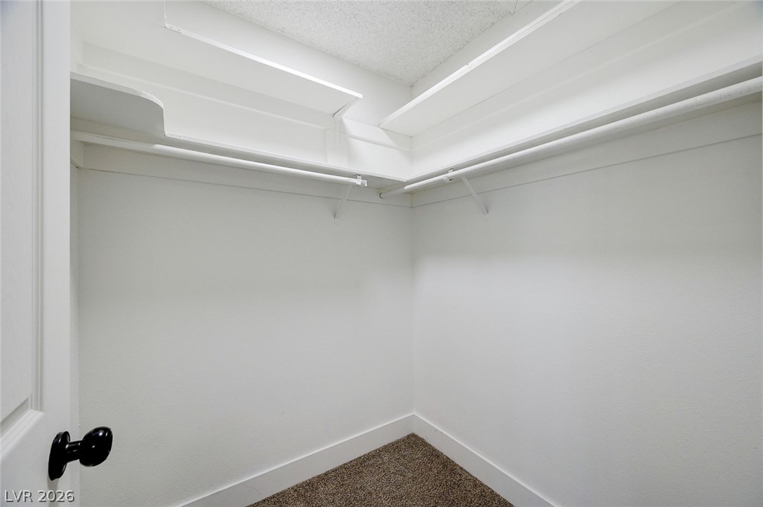 4840 Summerhill Road Las Vegas, NV 89121 - Photo 31 of 56 Well-appointed closet space features ample shelving and a convenient hanging rod.