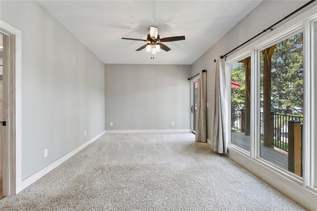 2040 Ridge Road Cumming, GA 30041 - Photo 28 of 52 a view of a livingroom with a ceiling fan and window