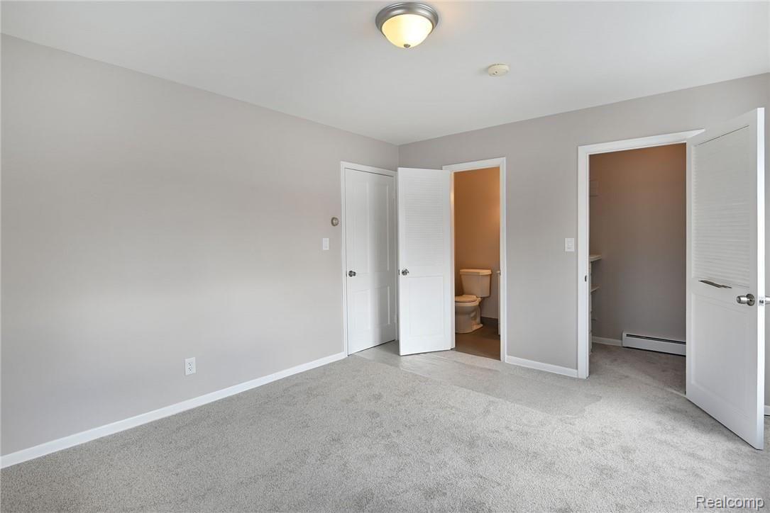 1194 Rocky Ridge Trail Flint, MI 48532 - Photo 25 of 41 1st Level Bedroom w/ Attached half bath and Walk-in Closet