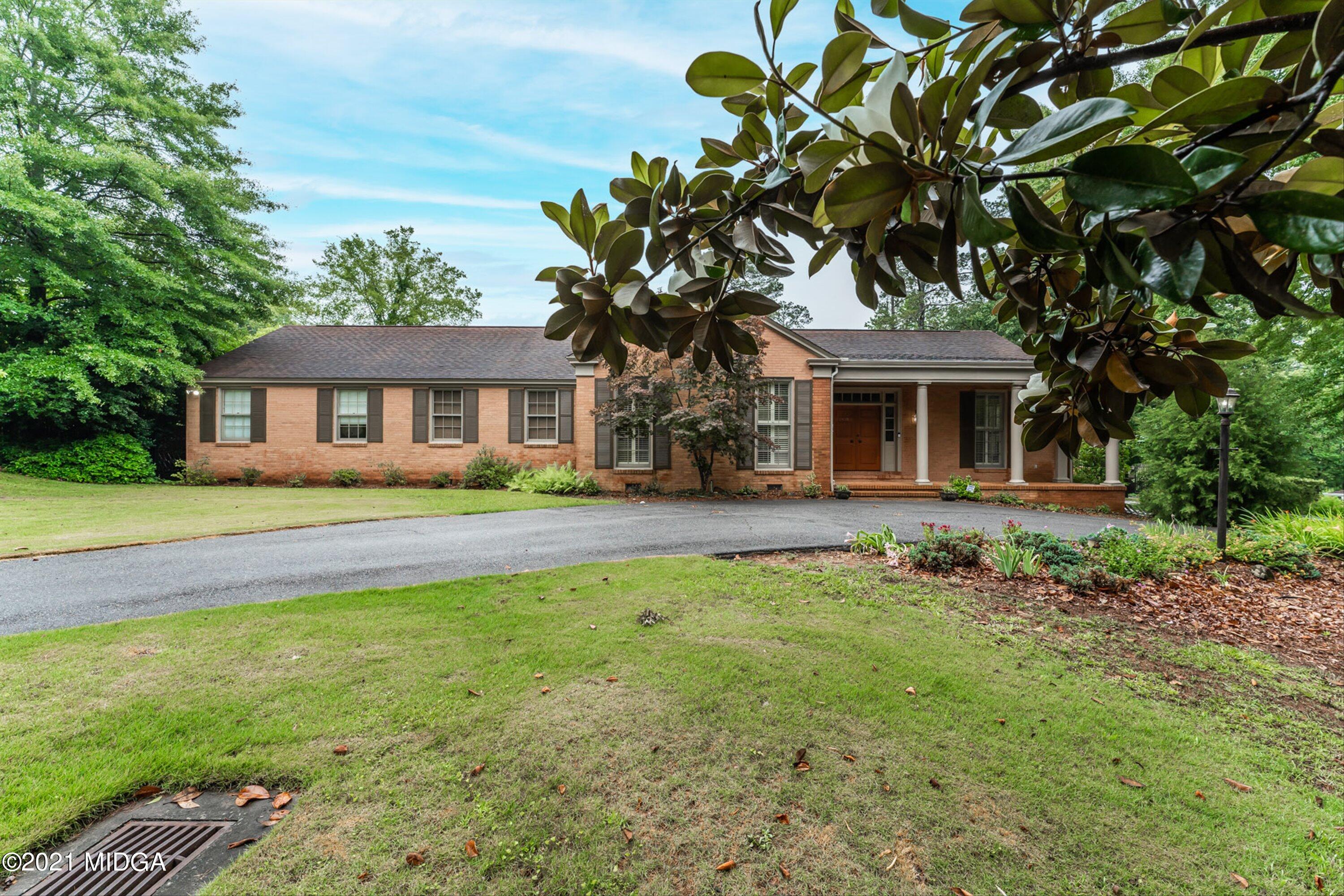 1845 Lincoln Road Macon, GA 31211 - Photo 2 of 31 a front view of a house with garden