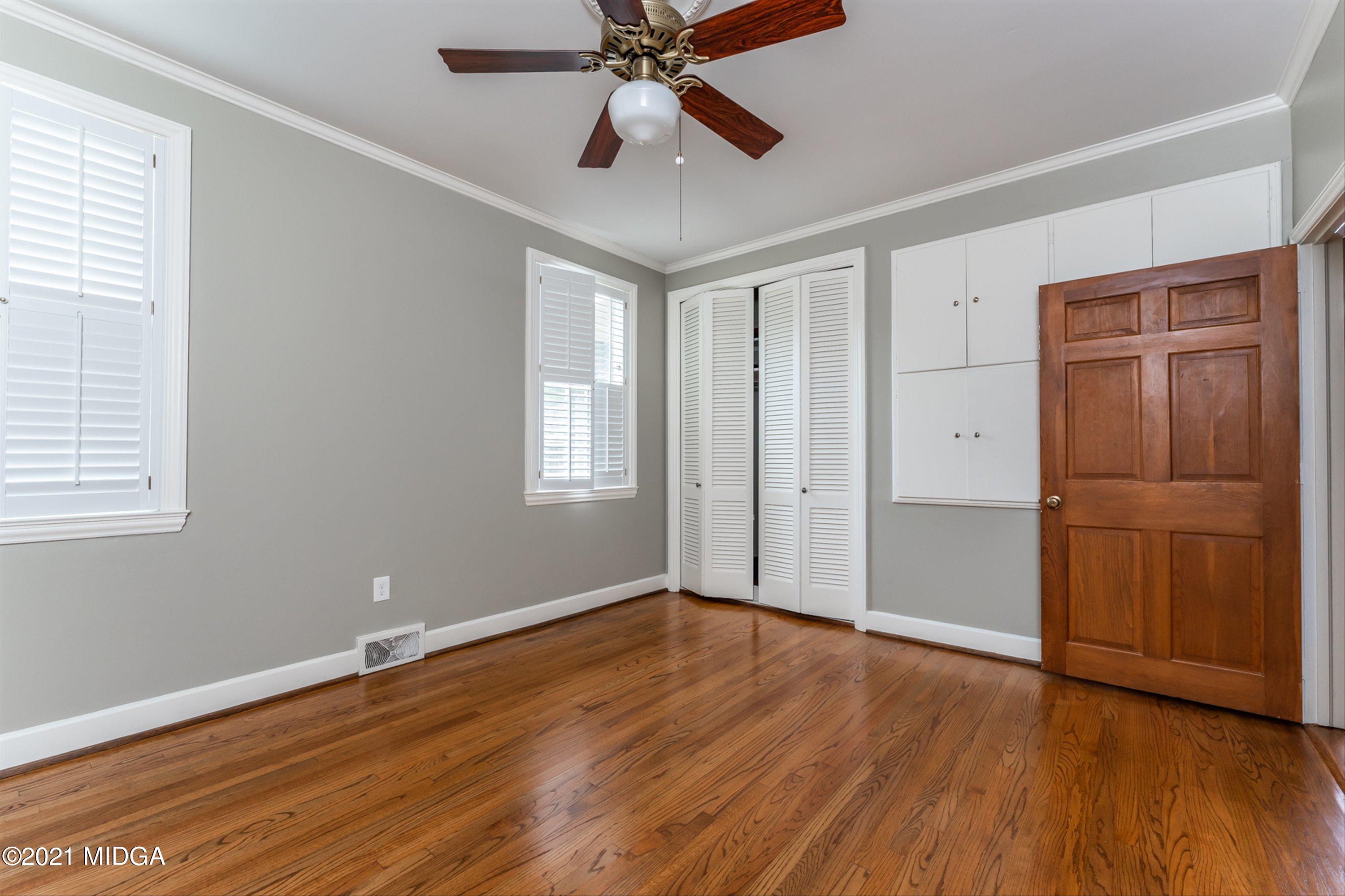 1845 Lincoln Road Macon, GA 31211 - Photo 19 of 31 a view of an empty room with wooden floor and a window