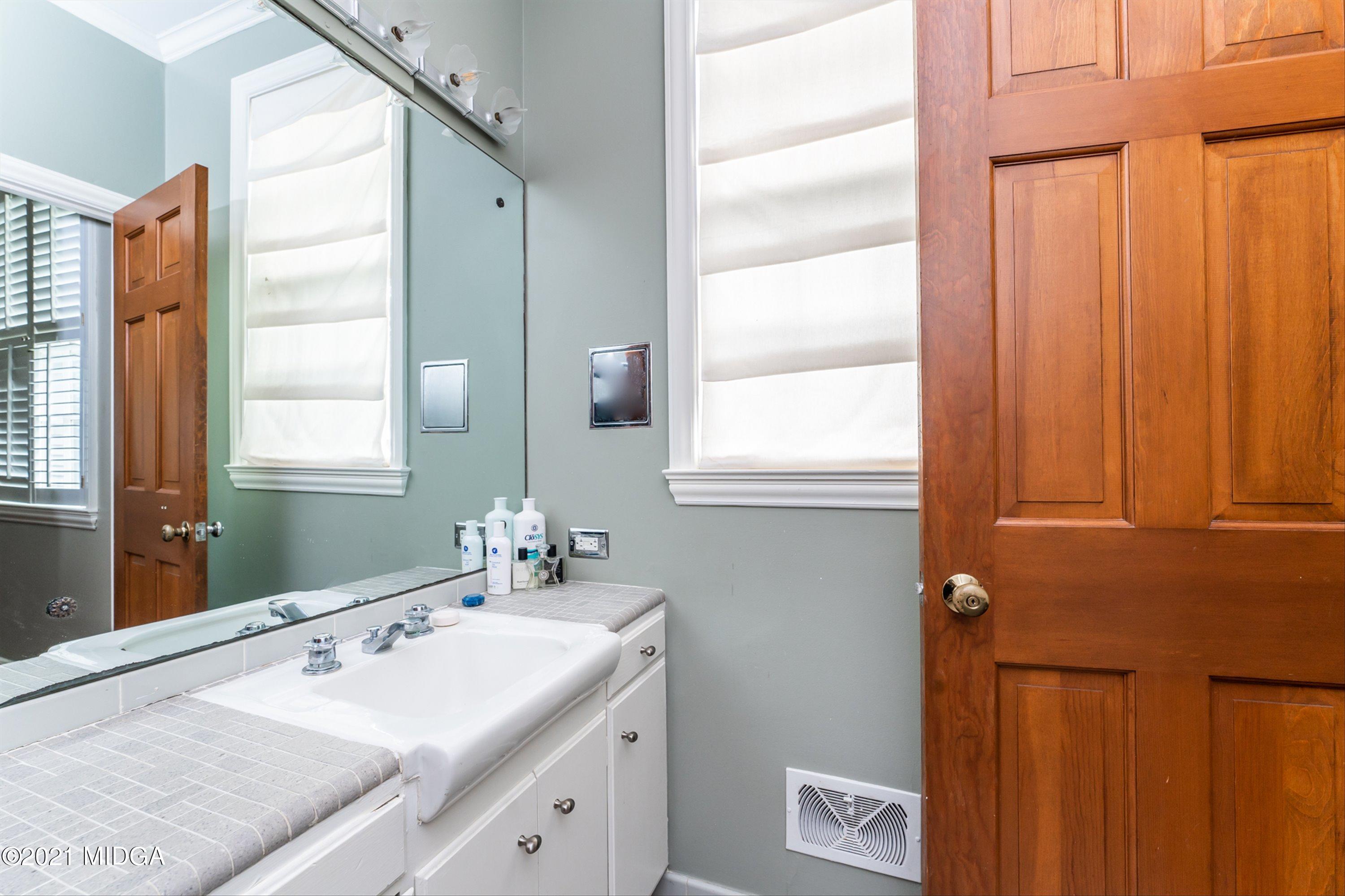 1845 Lincoln Road Macon, GA 31211 - Photo 20 of 31 a bathroom with a sink and a mirror