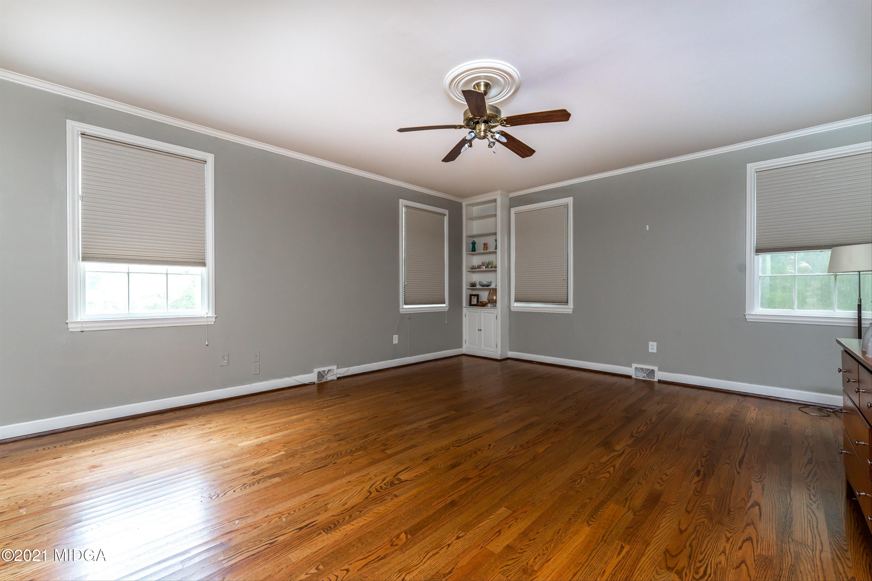 1845 Lincoln Road Macon, GA 31211 - Photo 22 of 31 a view of an empty room with wooden floor and a window