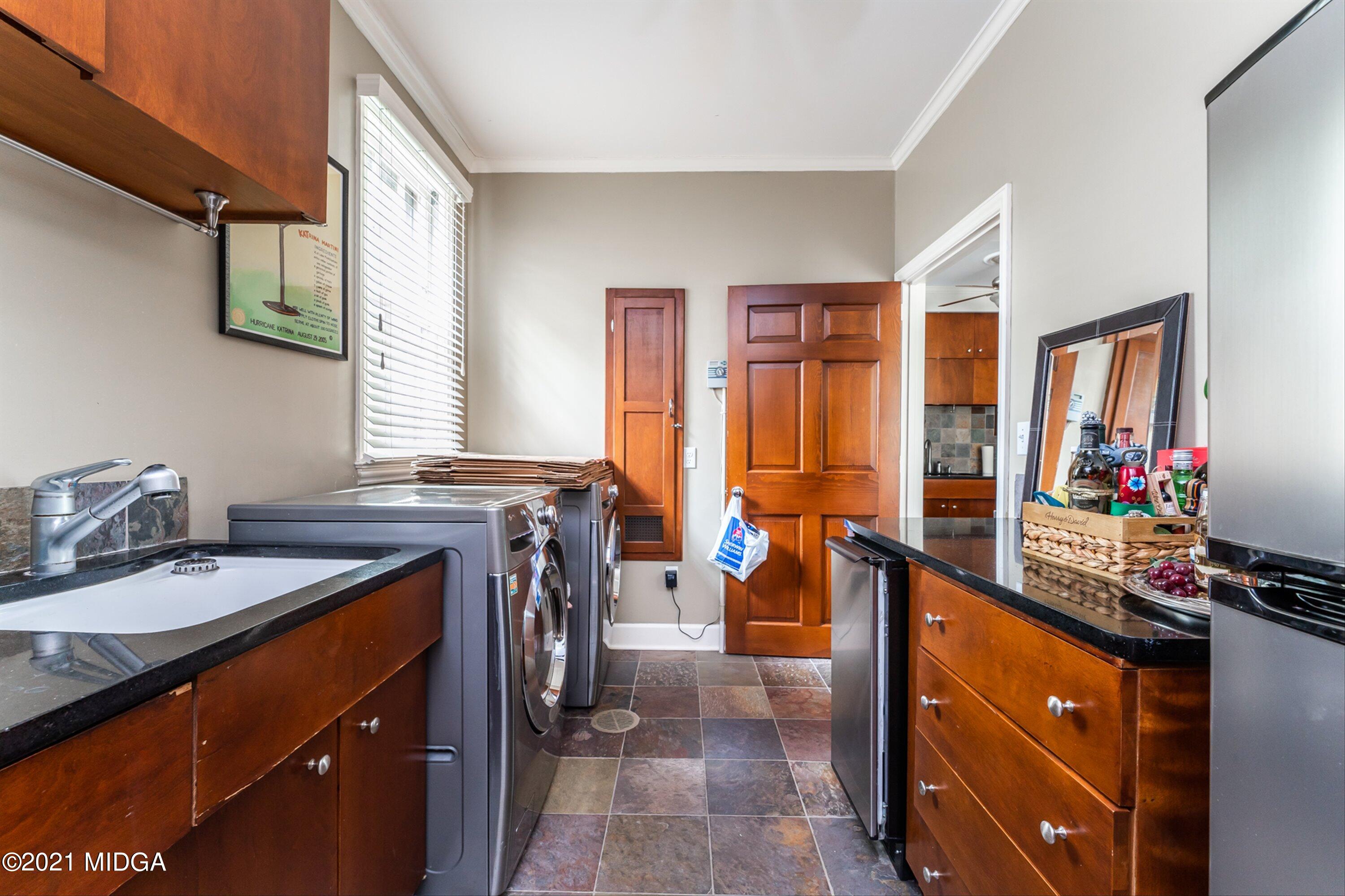 1845 Lincoln Road Macon, GA 31211 - Photo 27 of 31 a view of a kitchen with kitchen island granite countertop a sink counter top space and a stove top oven