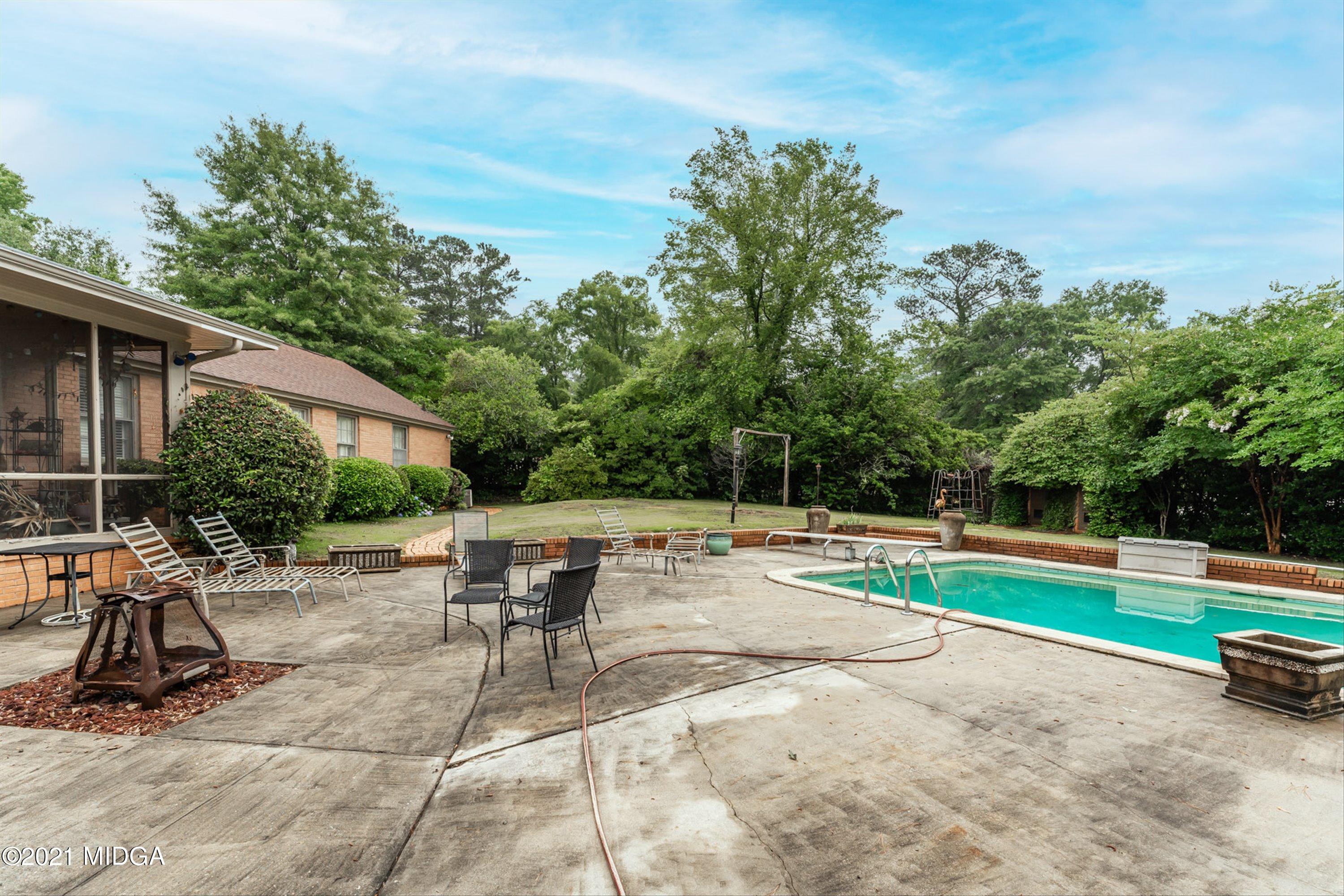 1845 Lincoln Road Macon, GA 31211 - Photo 29 of 31 a view of backyard with swimming pool and seating space
