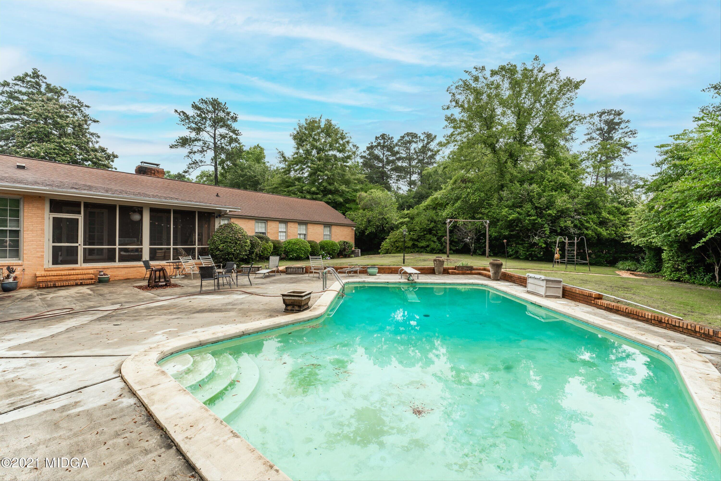 1845 Lincoln Road Macon, GA 31211 - Photo 30 of 31 a view of a house with swimming pool and porch