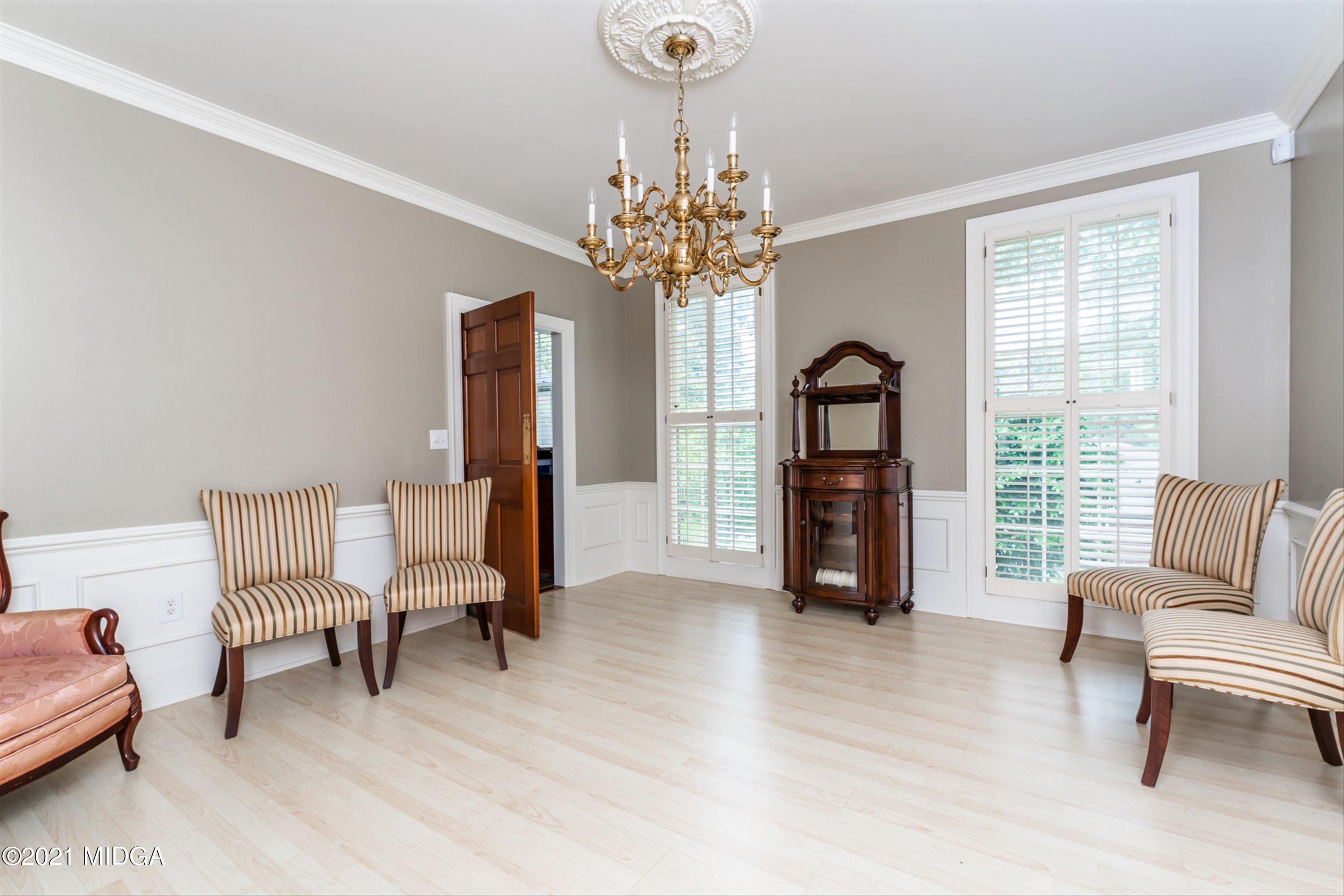 1845 Lincoln Road Macon, GA 31211 - Photo 8 of 31 a living room with furniture and a chandelier