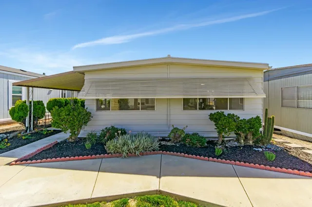 a front view of a house with garage