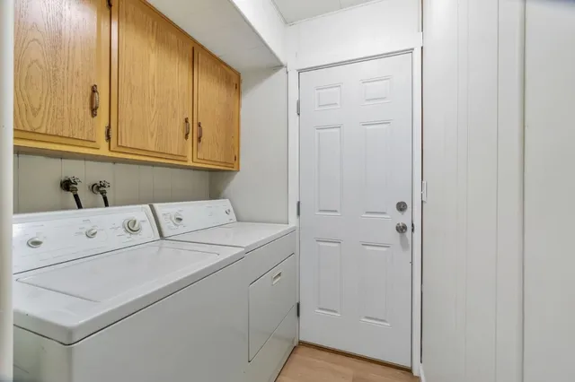 a bathroom with a bathtub shower sink vanity and toilet
