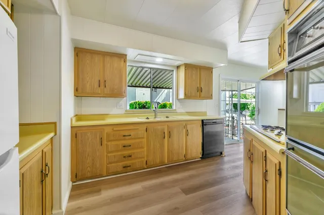 a view of an empty room and a window