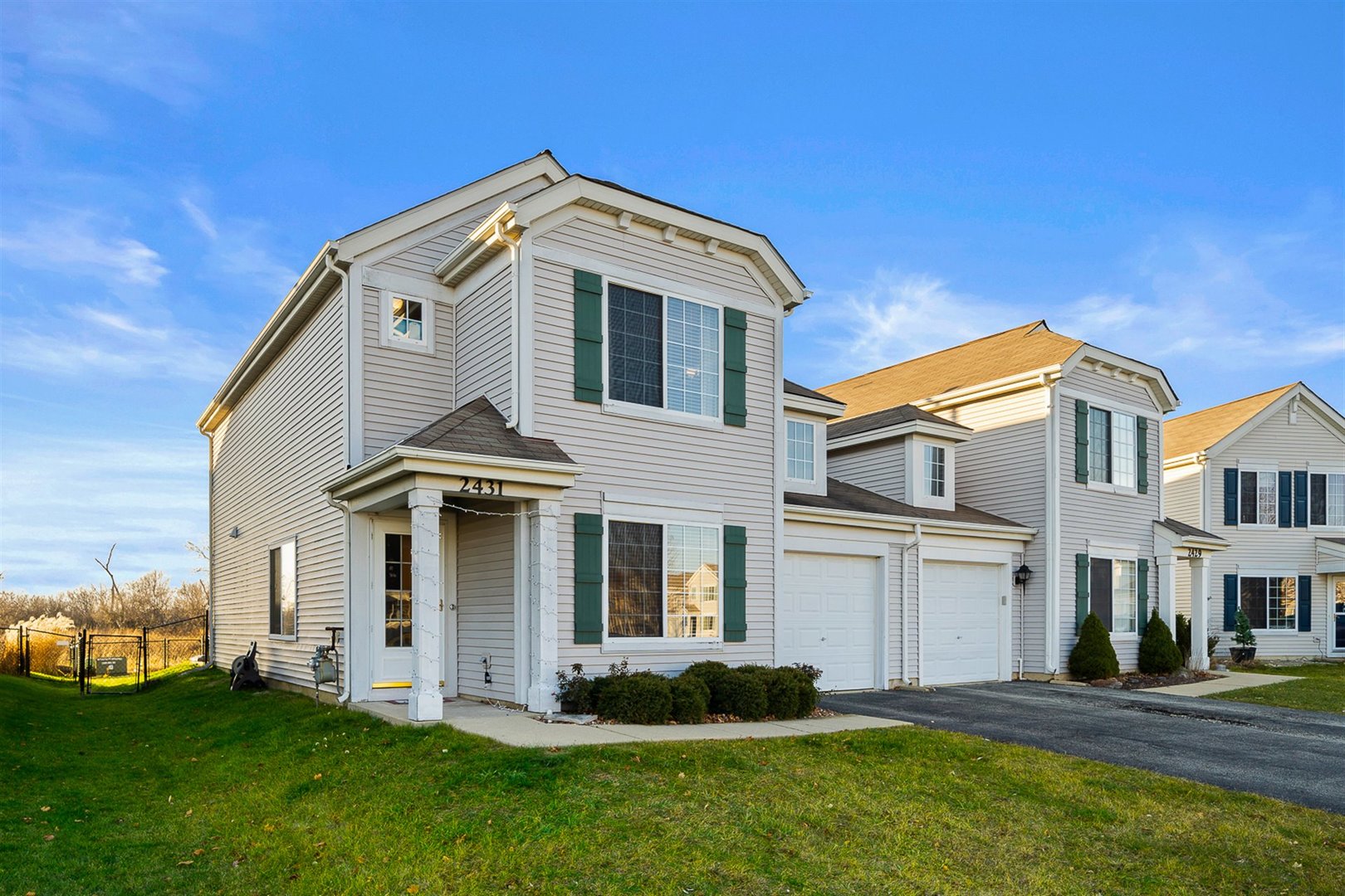 2431 Roxbury Lane Montgomery, IL 60538 - Photo 1 of 13 a front view of a house with a yard