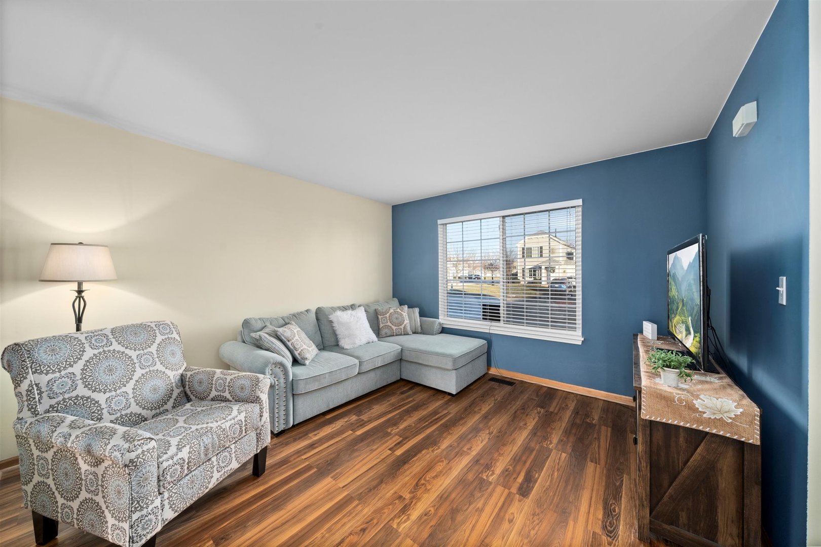 2431 Roxbury Lane Montgomery, IL 60538 - Photo 2 of 13 a living room with furniture and a flat screen tv
