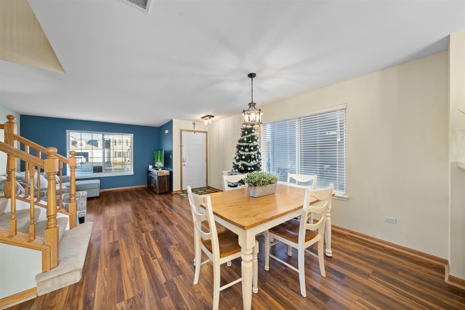 2431 Roxbury Lane Montgomery, IL 60538 - Photo 4 of 13 a view of a dining room with furniture window and wooden floor