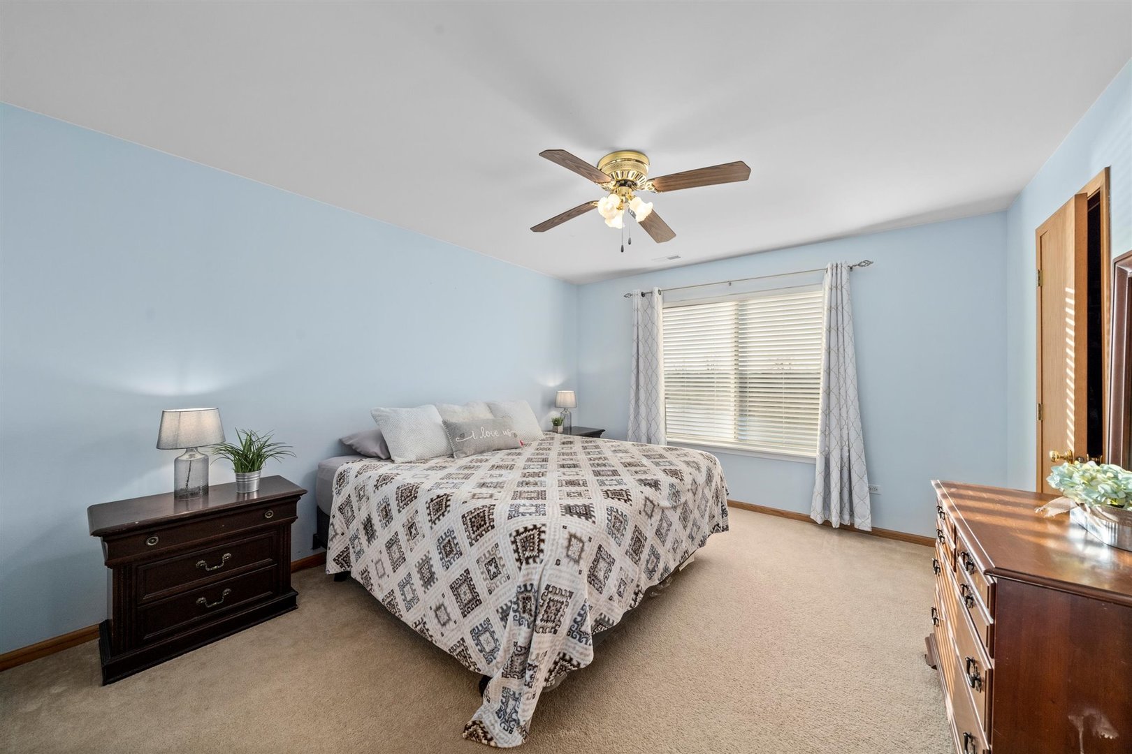 2431 Roxbury Lane Montgomery, IL 60538 - Photo 9 of 13 a bedroom with bed and window