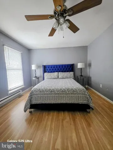 a bedroom with a bed and a view of room