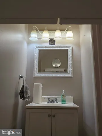 a bathroom with a sink and mirror