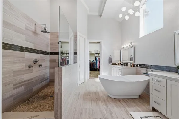 a view of a hallway with wooden floor and windows