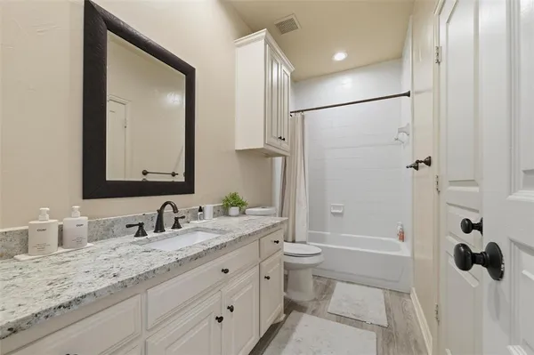 a bedroom with furniture and bed