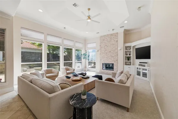 a kitchen with a sink a stove a refrigerator and chairs