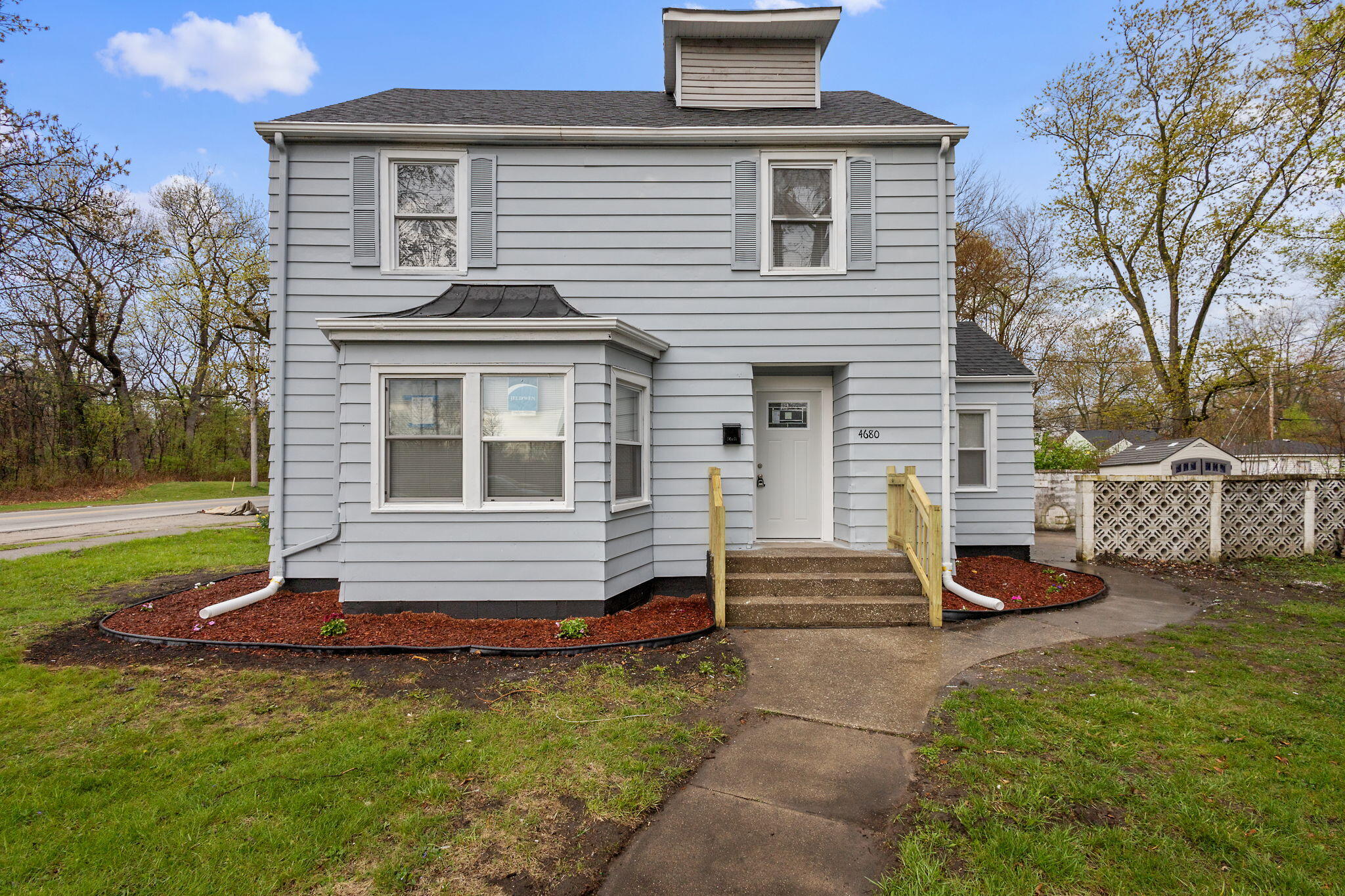 4680 Harrison Street Gary, IN 46408 - Photo 1 of 26 a front view of a house with a garden
