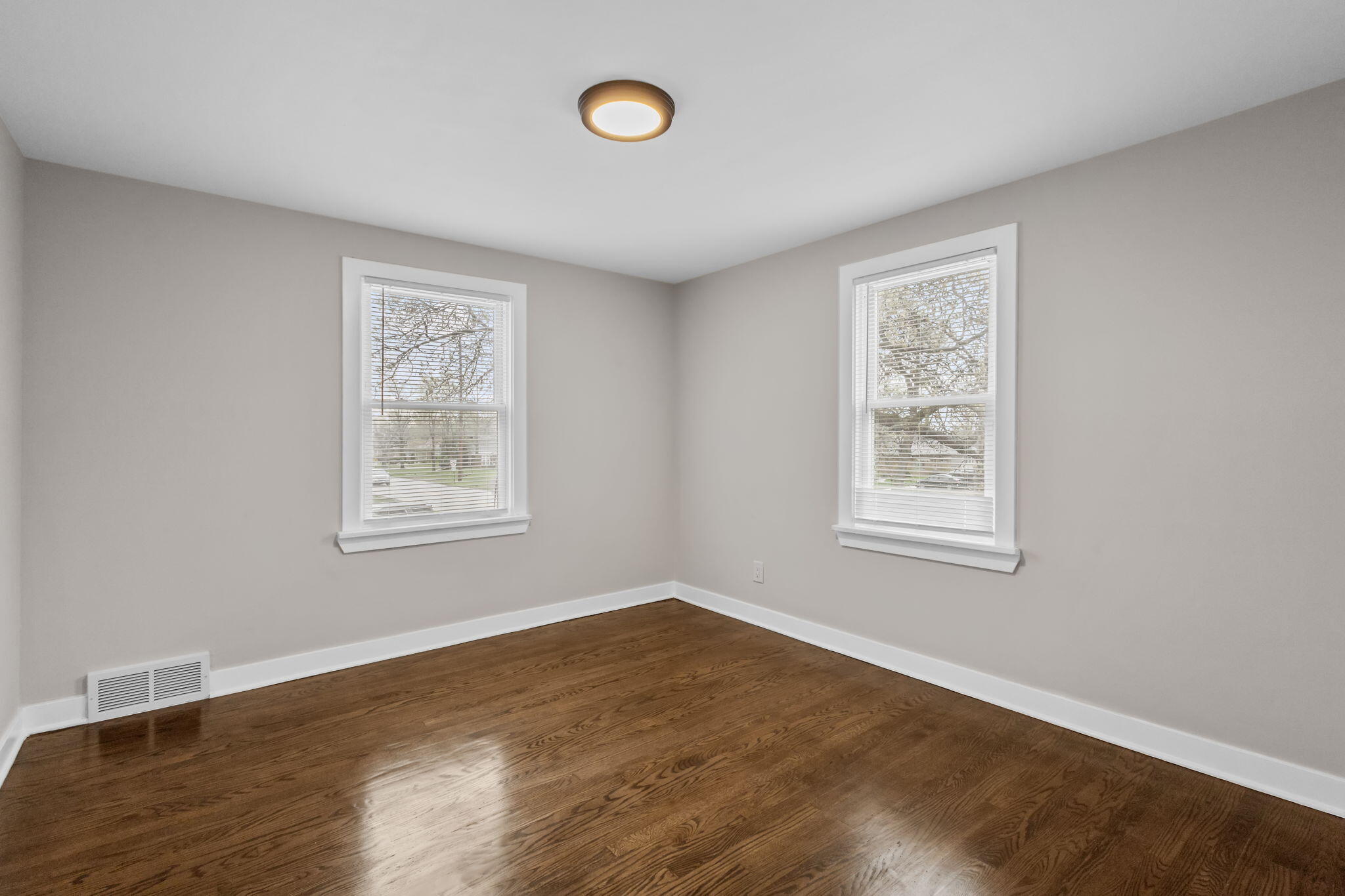 4680 Harrison Street Gary, IN 46408 - Photo 14 of 26 wooden floor in an empty room with a window