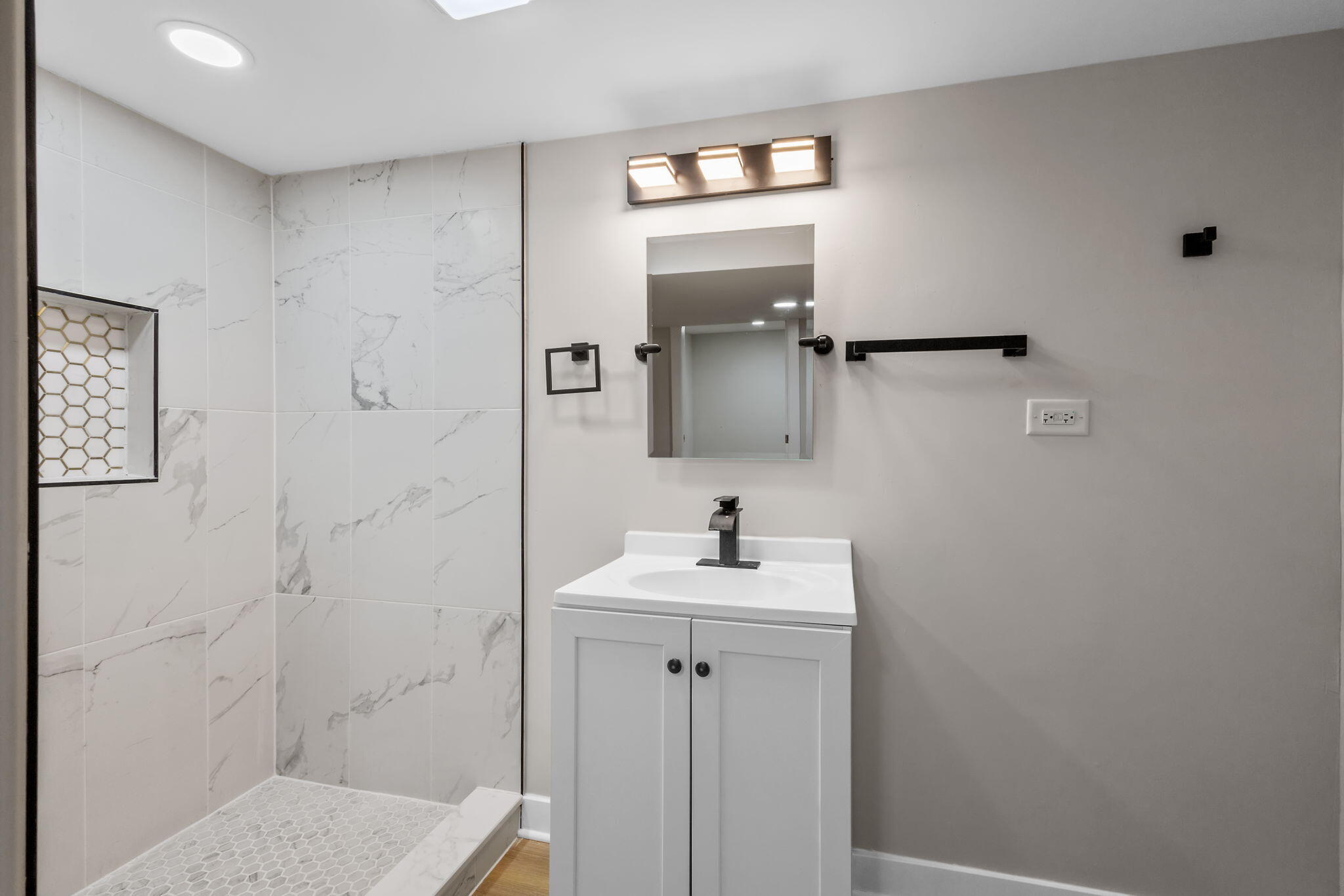 4680 Harrison Street Gary, IN 46408 - Photo 24 of 26 a bathroom with a sink a toilet and mirror