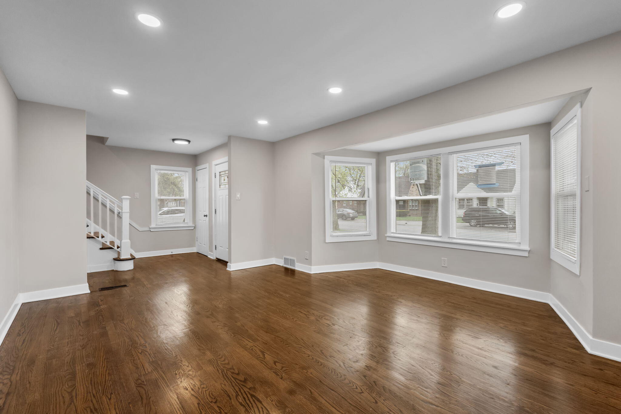 4680 Harrison Street Gary, IN 46408 - Photo 4 of 26 a view of empty room with wooden floor and fan