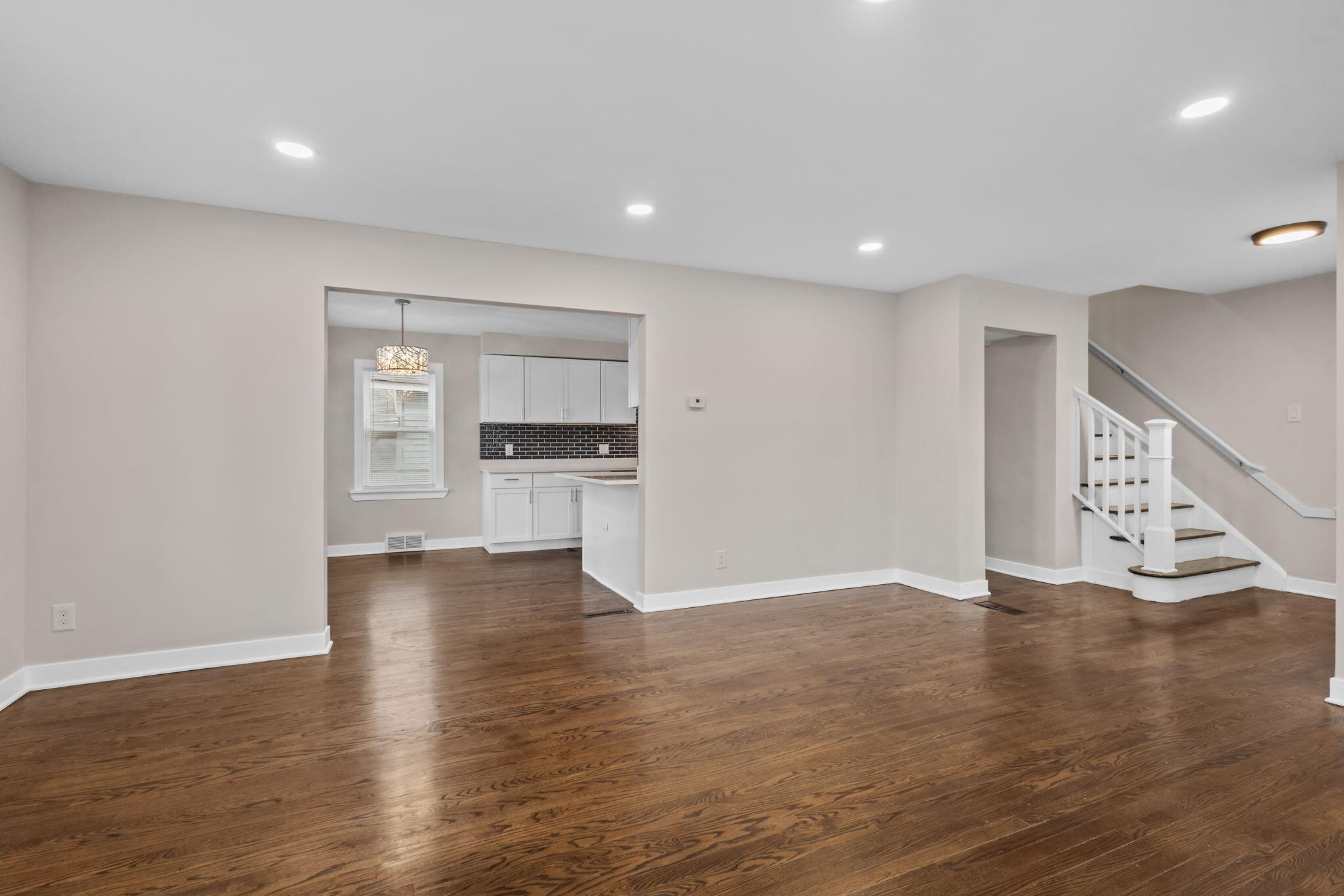 4680 Harrison Street Gary, IN 46408 - Photo 5 of 26 a view of an empty room with a window and wooden floor