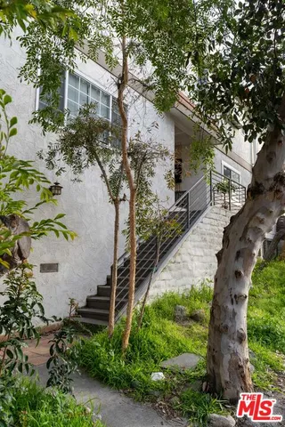 a aerial view of a house with a yard