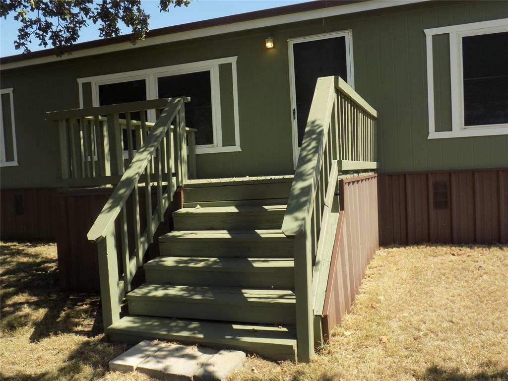 12792 Highway 199 Poolville, TX 76487 - Photo 3 of 24 Up close look at the front door deck