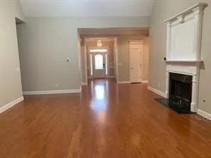 a view of livingroom with hardwood floor and a fireplace