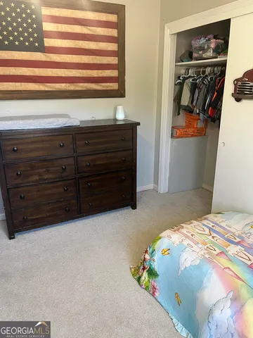 a bedroom with a bed and a cabinets