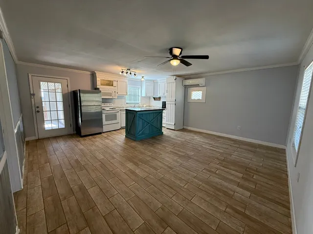 a view of a livingroom with a kitchen